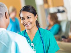 Female nurse speaking to a patient