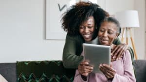 Blog Cover- Caregiver hugging older women