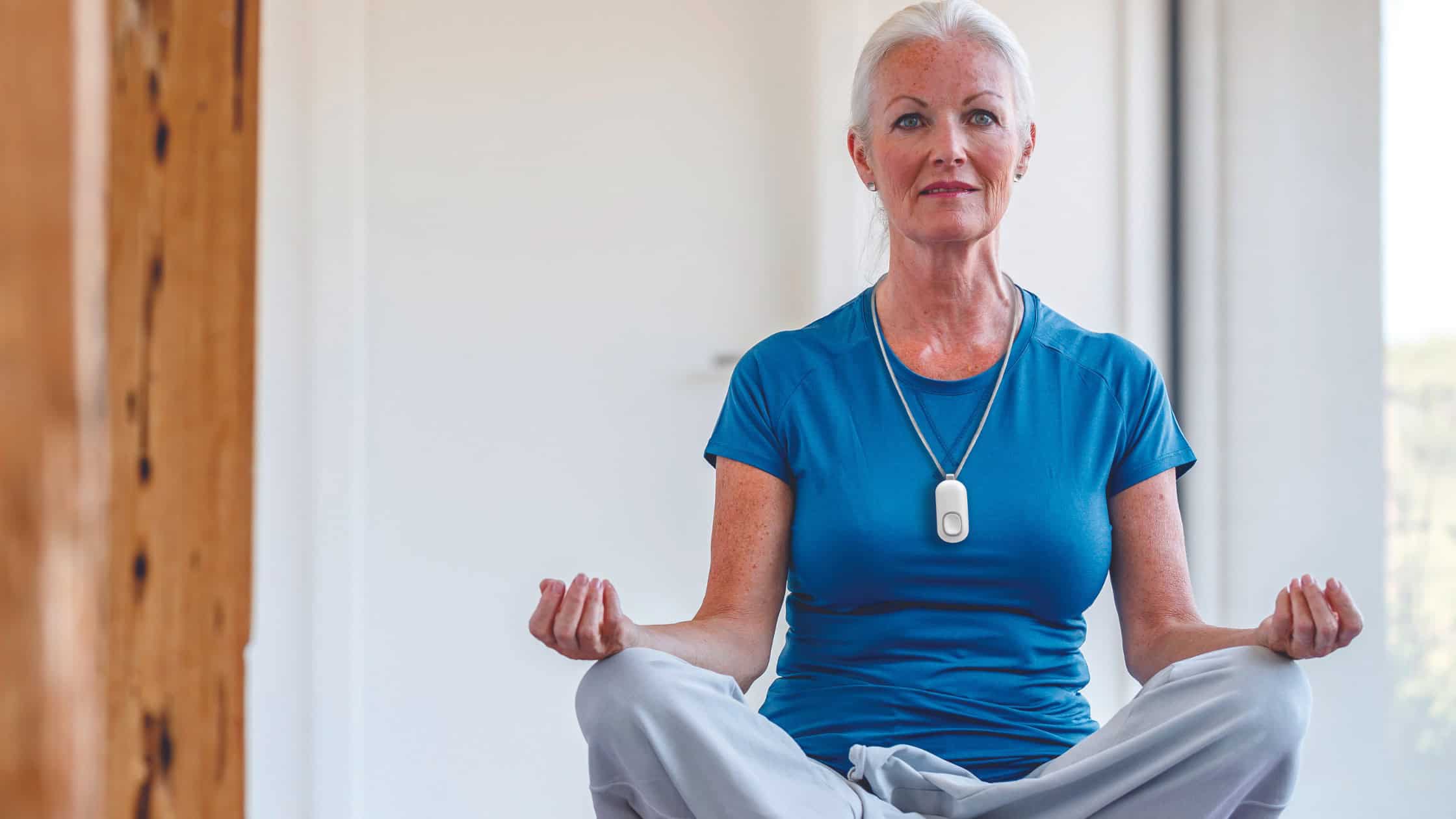Blog Cover- Women wearing lifeline button doing yoga
