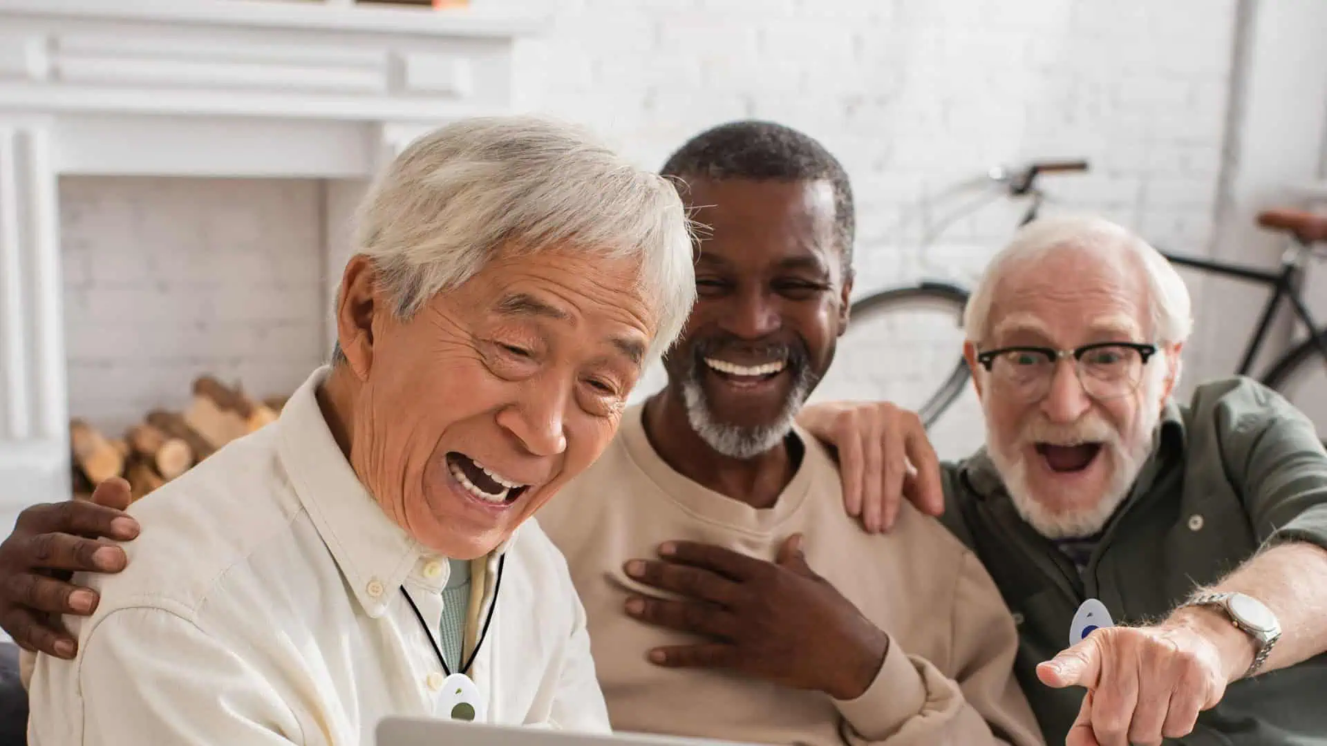 Multiple older men wearing lifeline buttons Multiple older men wearing lifeline buttons