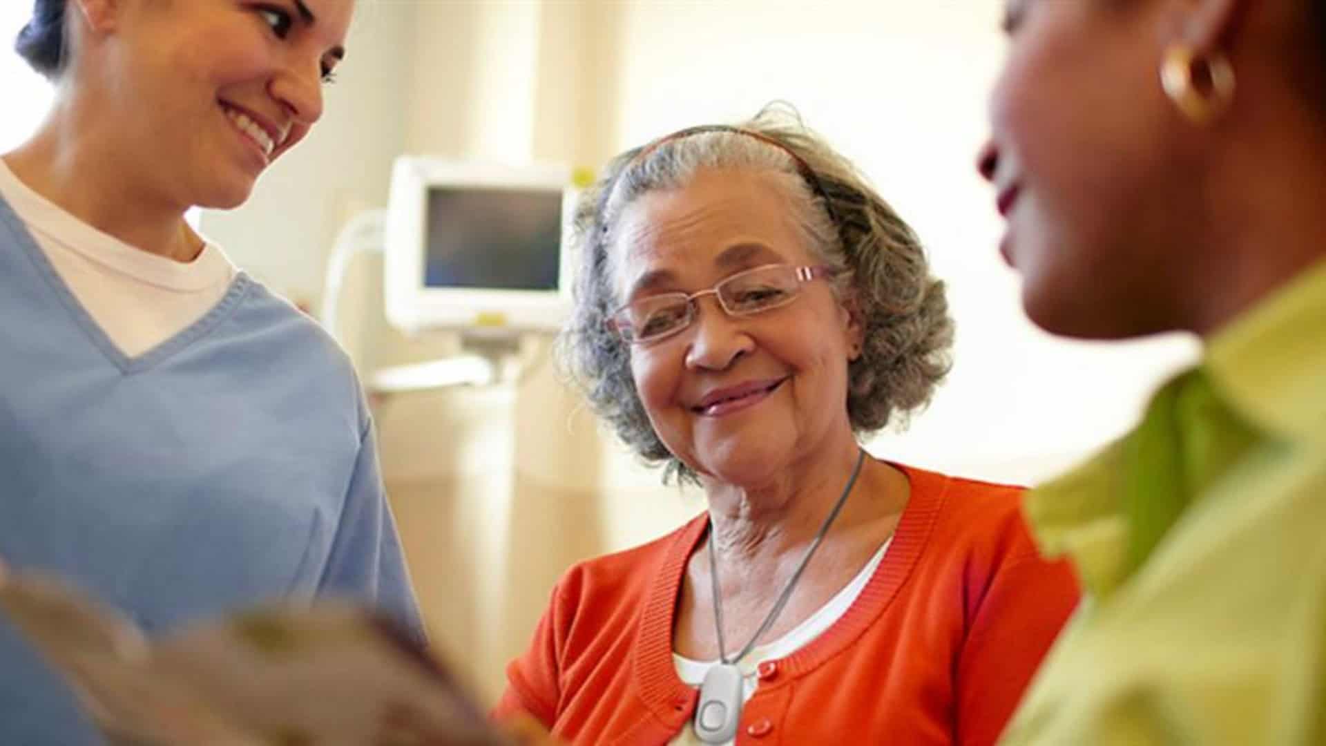 women wearing lifeline chatting with healthcare worker