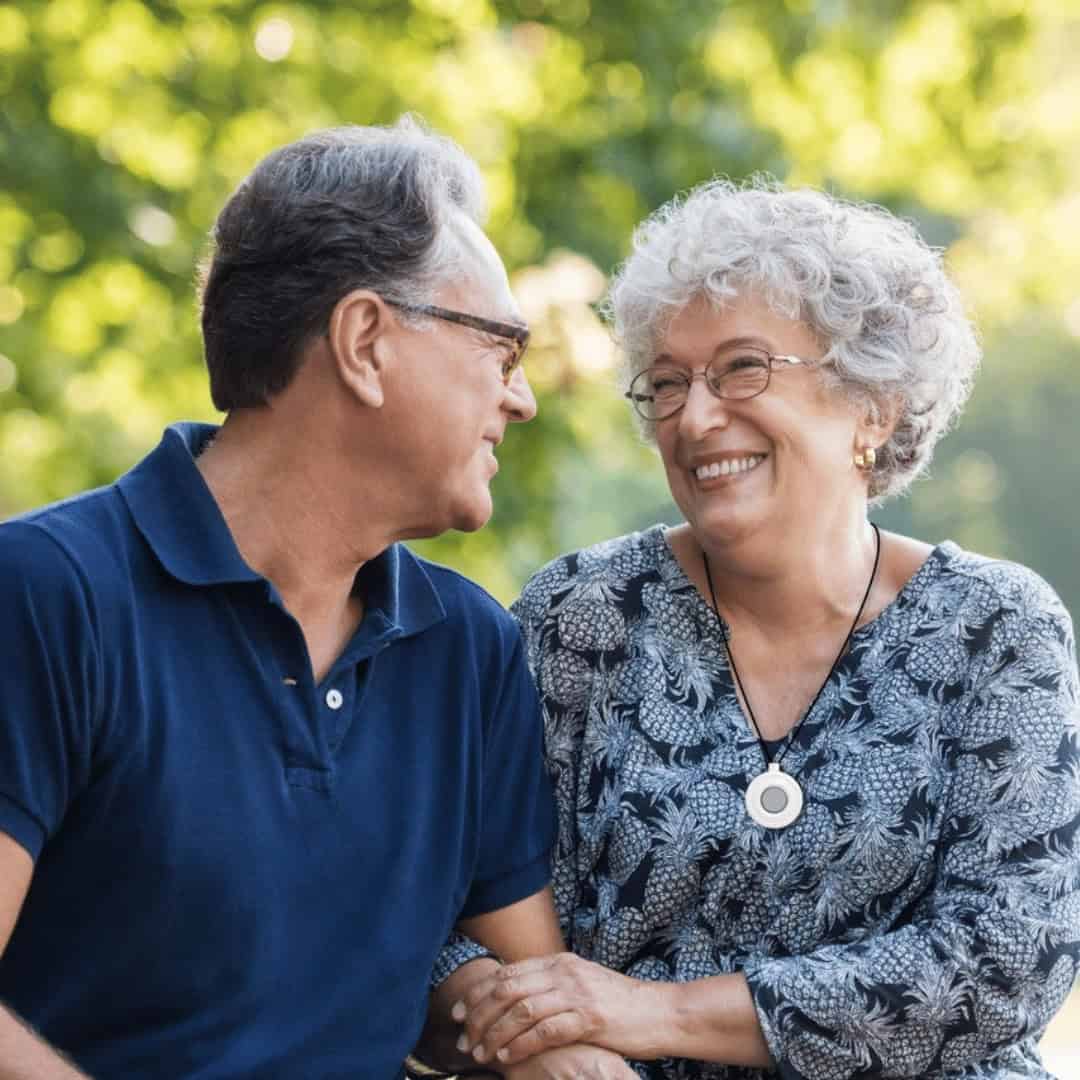 Older women wearing lifeline smiling at man