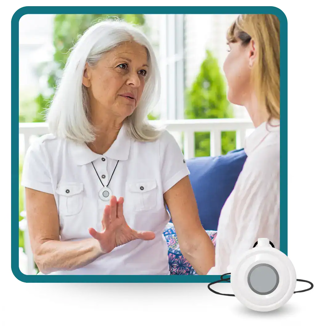 Women chatting and wearing Lifeline HomeSafe